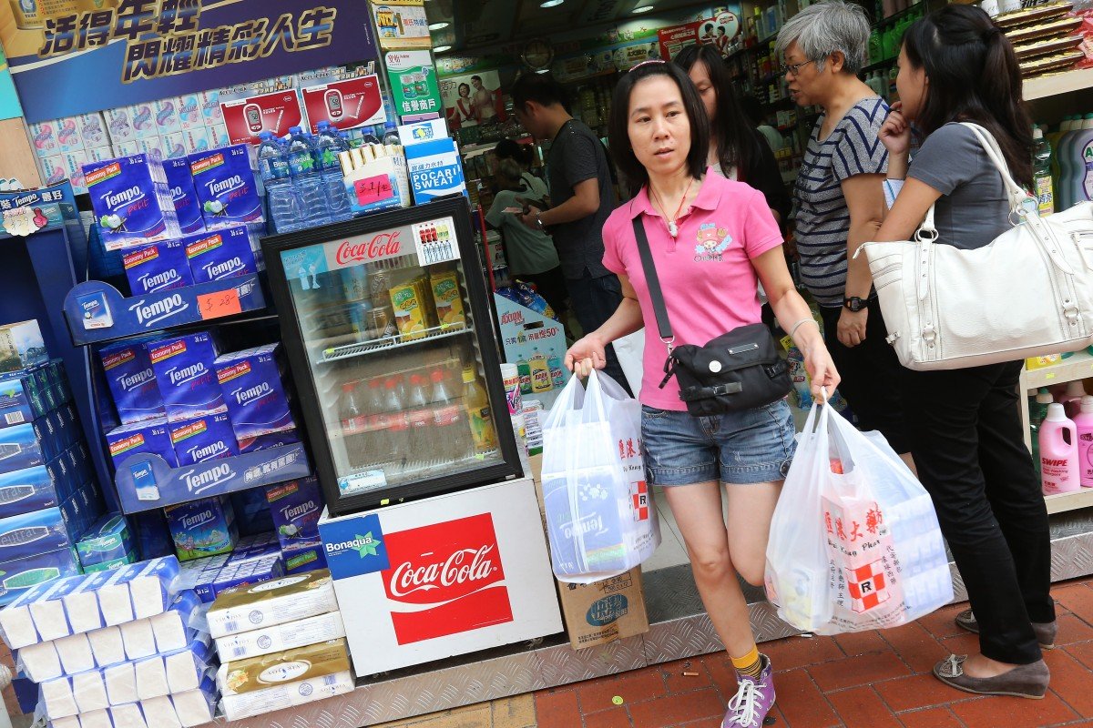 Mainland Chinese visitors are seen at a pharmacy at Tsuen Wan on 28 August 2012. Photo: SCMP