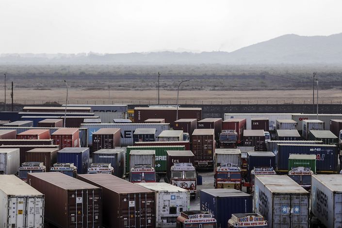Container trucks sit parked near the Jawaharlal Nehru Port. Photo: Bloomberg