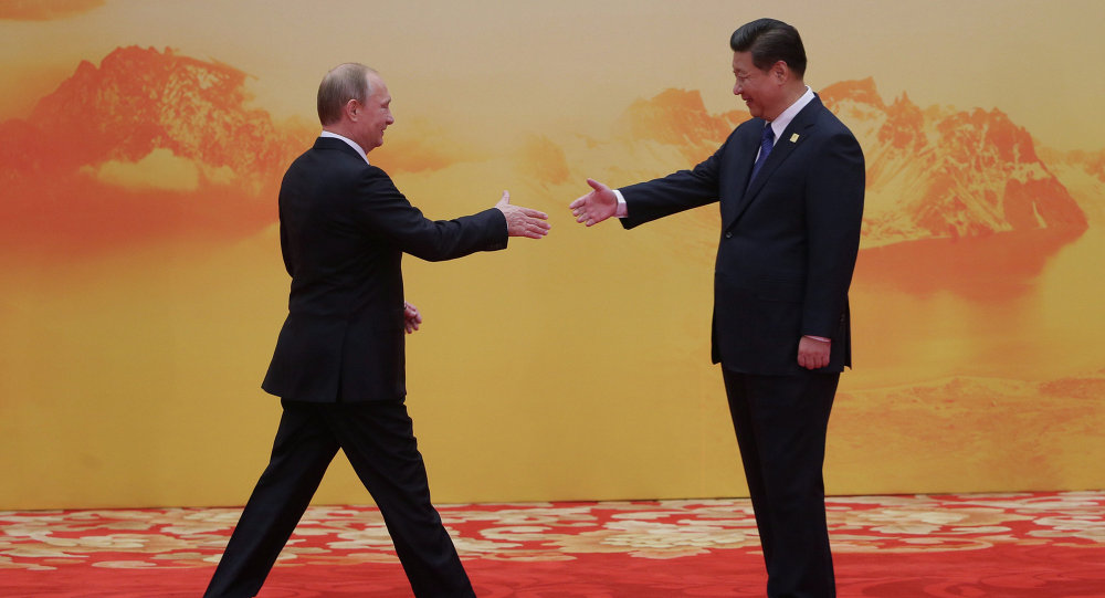 Tổng thống Nga Vladimir Putin và Chủ tịch Tập Cận Bình (Ảnh:
